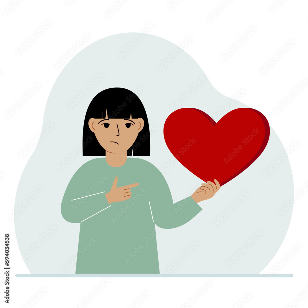 A girl holds a big red heart in his hand. The concept of volunteering, romantic relationship or love. A girl holds a big red heart in his hand. The concept of volunteering, romantic relationship or love.