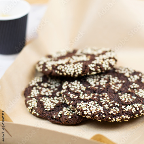 Chocolate cookies with seeds on paper