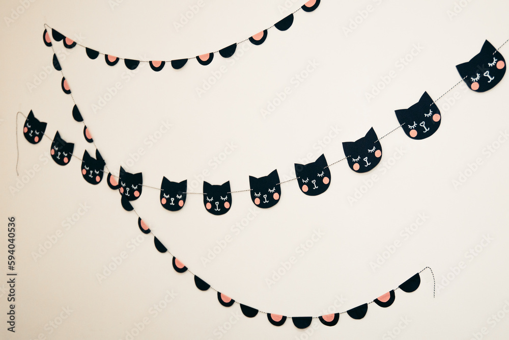 Naklejka premium garlands on the wall. cats