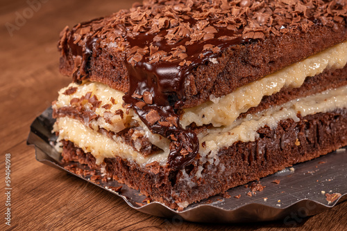 Chocolate cake with coconut and chocolate sauce © Klinsmann