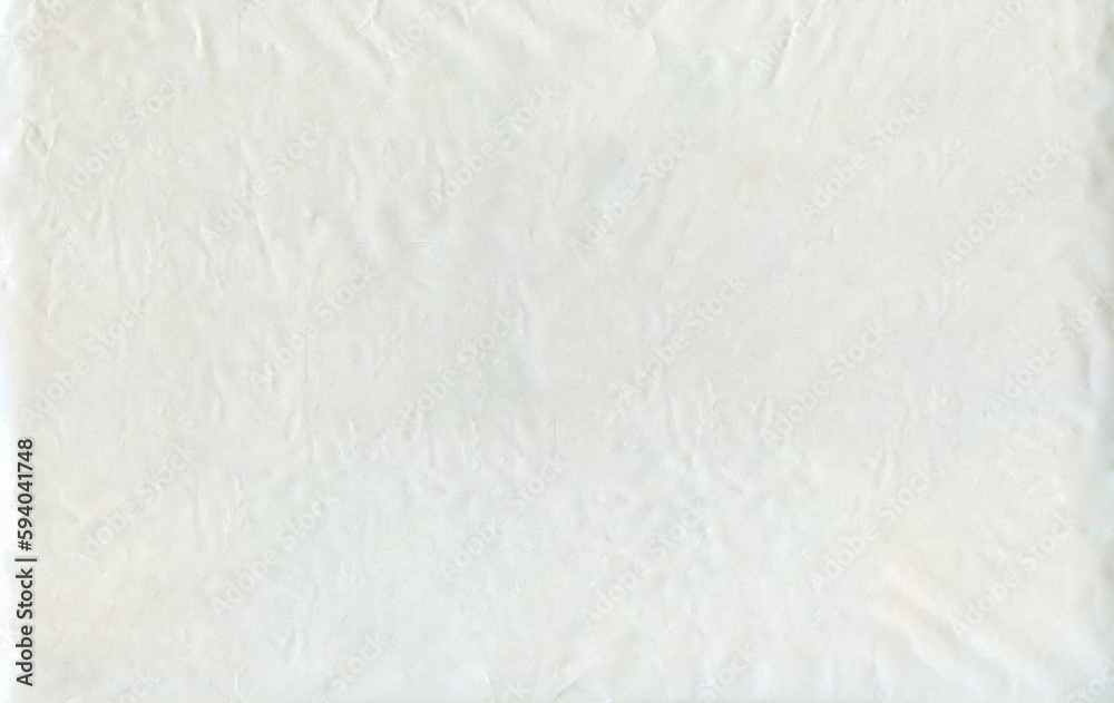 White background texture of ecological package or plastic bag with d2w additive. Such plastic does not pose a threat to the environment and does not pose a danger to animals and plants. White background texture of ecological package or plastic bag with d2w additive. Such plastic does not pose a threat to the environment and does not pose a danger to animals and plants.