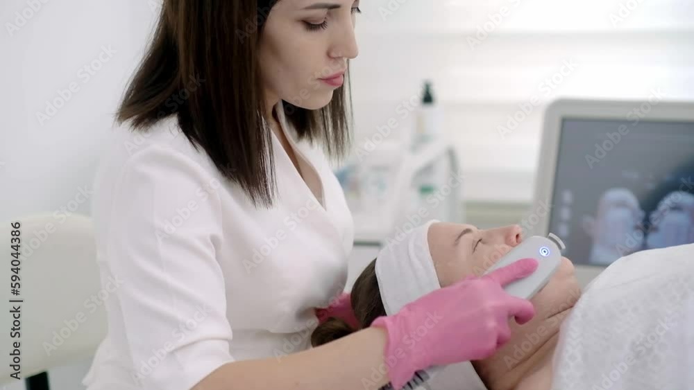 doctor uses laser machines and ultrasound lifting to rejuvenate your skin, all while monitoring the procedure on a device screen doctor uses laser machines and ultrasound lifting to rejuvenate your skin, all while monitoring the procedure on a device screen