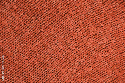 red unusual texture.knitted red sweater close up. handmade concept 