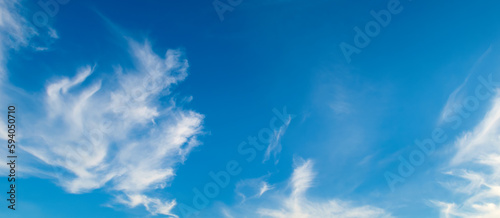 Blue sky with beautiful clouds. Wide photo.