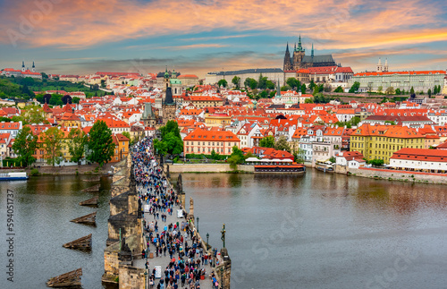 Prague cityscape with Charles Bridge over Vltava river and Prague castle at sunset, Czech Republic