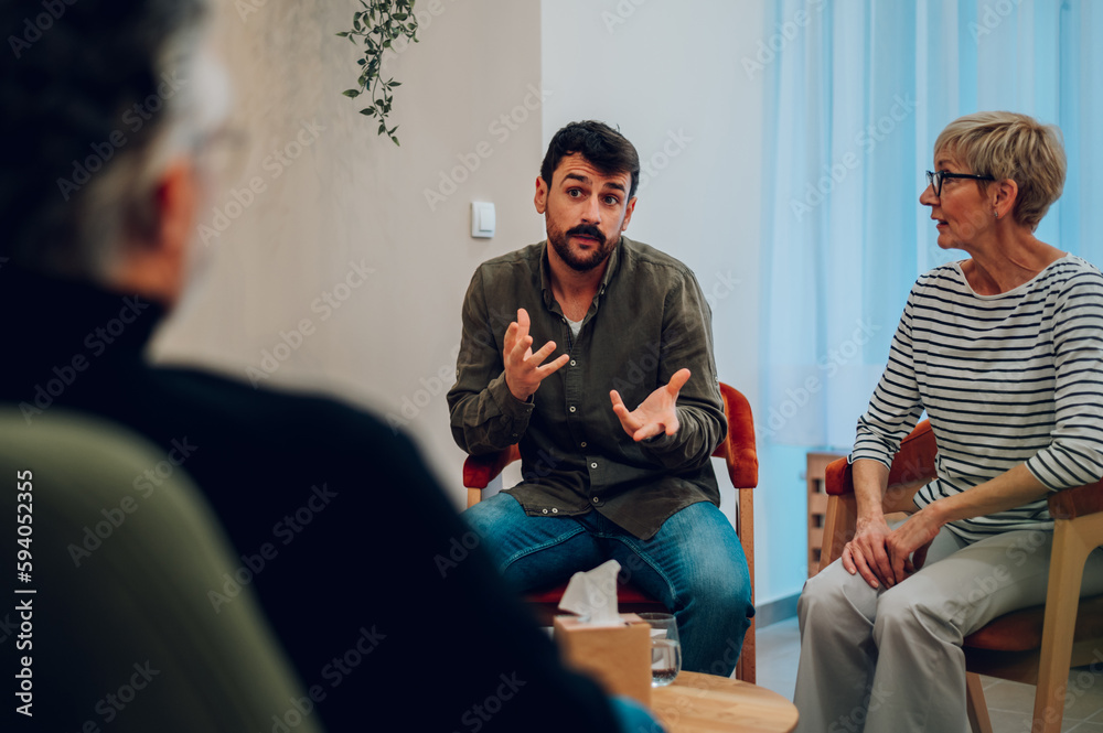 Ταπετσαρία Young man talking about his mental health on a group therapy session