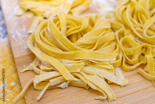 Close up of Pasta and Hands making home made Italian Pasta