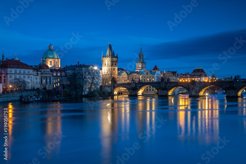 Evening view of Prague's Old Town and Charles Bridge from the river level after sunset © Ladislav_Zemanek