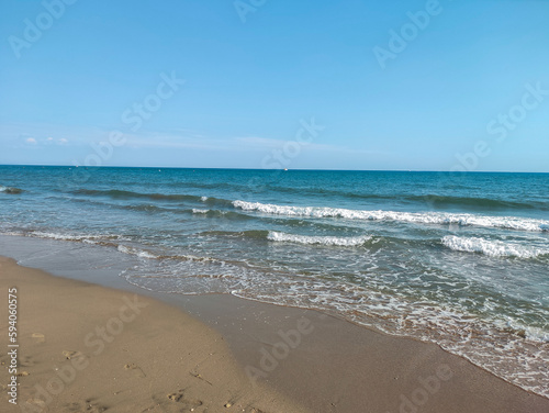 Fototapeta Naklejka Na Ścianę i Meble -  beach and sea, calm vacation day at the seaside, blue sky view on the sea