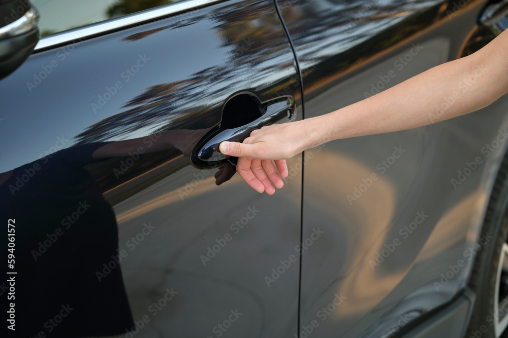 Closeup of driver hand opening car front door with touch ID finger imprint  scanning technology. Vehicle safety concept Stock Photo | Adobe Stock