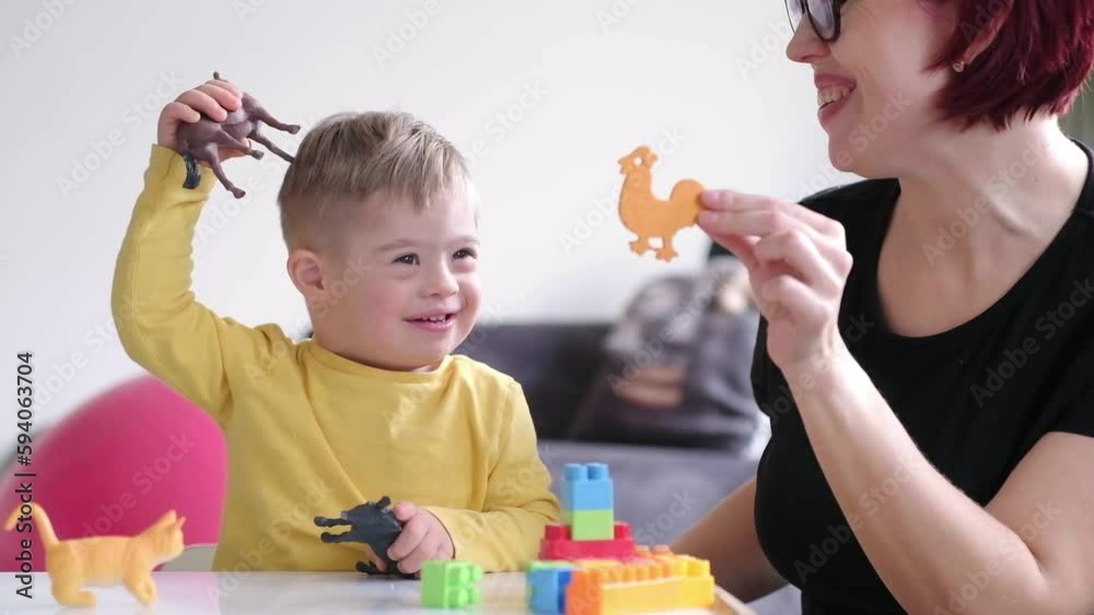 parent bonding with their child with Down syndrome through an educational and stimulating activity, promoting a positive learning experience parent bonding with their child with Down syndrome through an educational and stimulating activity, promoting a positive learning experience