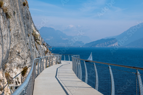 Cycle path in Limone sul Garda near lake Garda in sunny spring day