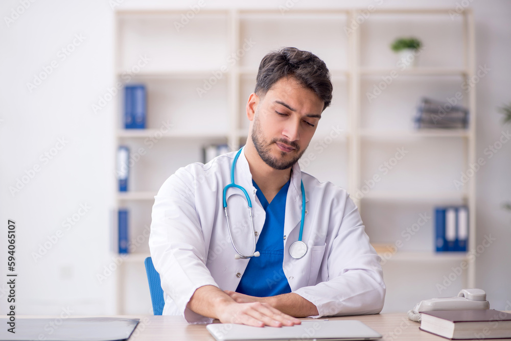 Young male doctor in telemedicine concept Young male doctor in telemedicine concept