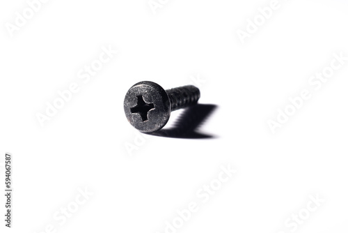 A dramatic close up of a screw with a macro lens. White background