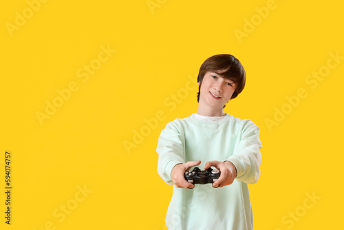 Teenage boy with game pad o...