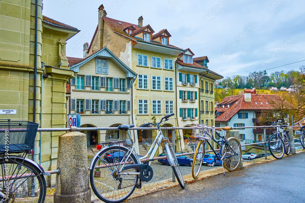 The bicycle parking along the railings of sidewalk of Nydeggtreppe staircases in Bern, Switzerland