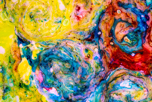 Abstract fluid art of bright colors and chaotic shapes. Drops of colors forming universes