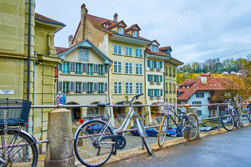 Obraz na płótnie The bicycle parking along the railings of sidewalk of Nydeggtreppe staircases in Bern, Switzerland w salonie