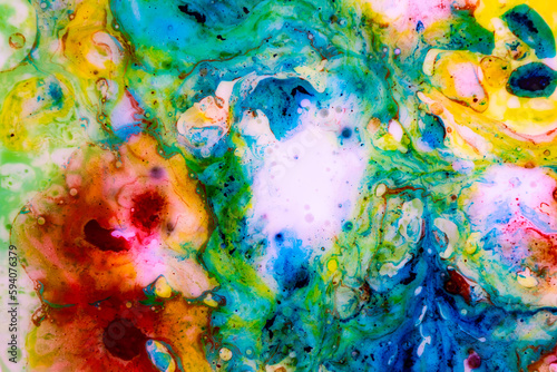 Abstract fluid art of bright colors and chaotic shapes.