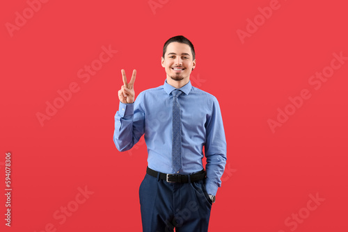 Handsome businessman showin...