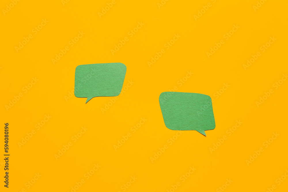 Blank paper speech bubbles on orange background Blank paper speech bubbles on orange background