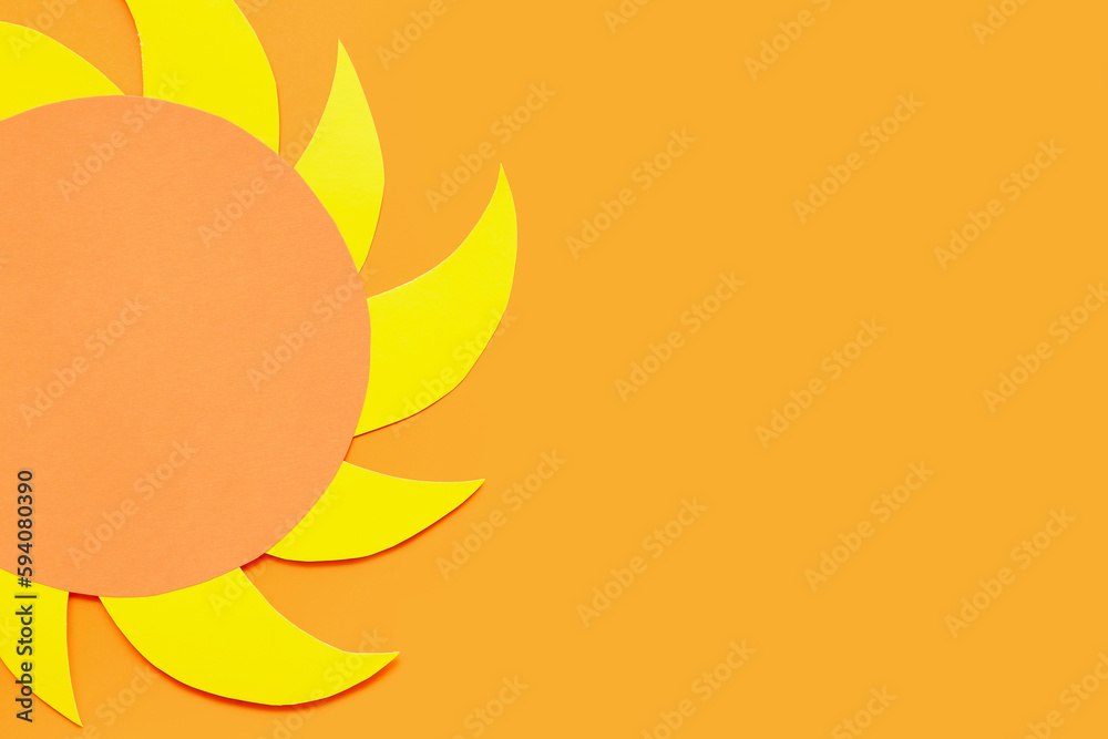 Bright sun made of paper on orange background Bright sun made of paper on orange background