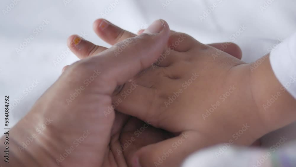 father holding hand of baby child, close up . father holding hand of baby child, close up .