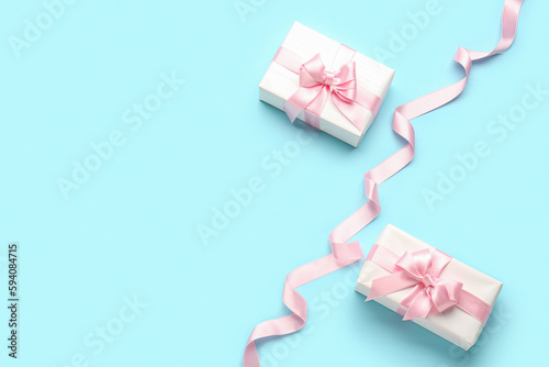 Two white gift boxes with p...