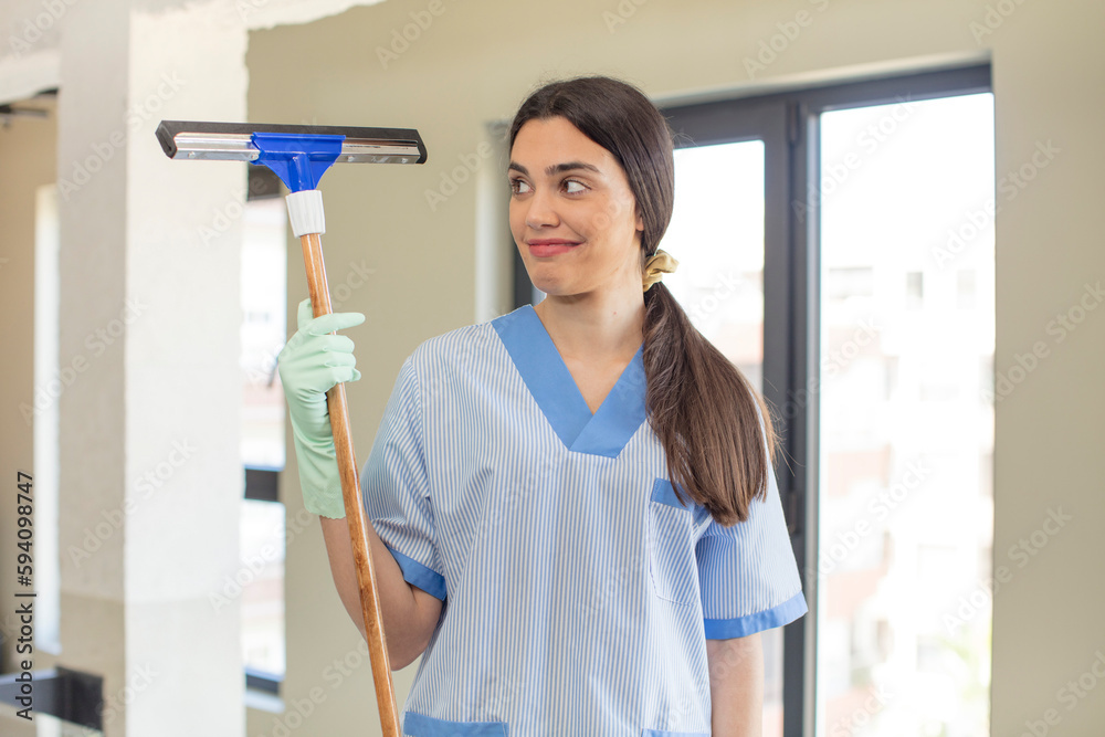 pretty young model smiling and looking with a happy confident expression. windows washer concept pretty young model smiling and looking with a happy confident expression. windows washer concept