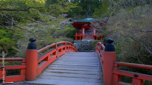 Wallpaper Mural traditional Japanese garden with a red wooden bridge and pavilion in Kyoto, Daigo-ji temple in Kyoto in spring, buddhist shrine in Kyoto Torontodigital.ca
