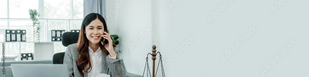 Call mobile, cellphones, Online consulting with laptop in office of asian thai japanese chinese female exclusive lawyer legal advisor, legislation, saleswoman, legal contract documents