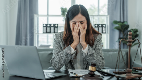 headache, contemplation, worry, stress, frustrated, Online consulting with laptop in office of asian thai japanese chinese female exclusive lawyer legal advisor, legislation, legal contract documents
