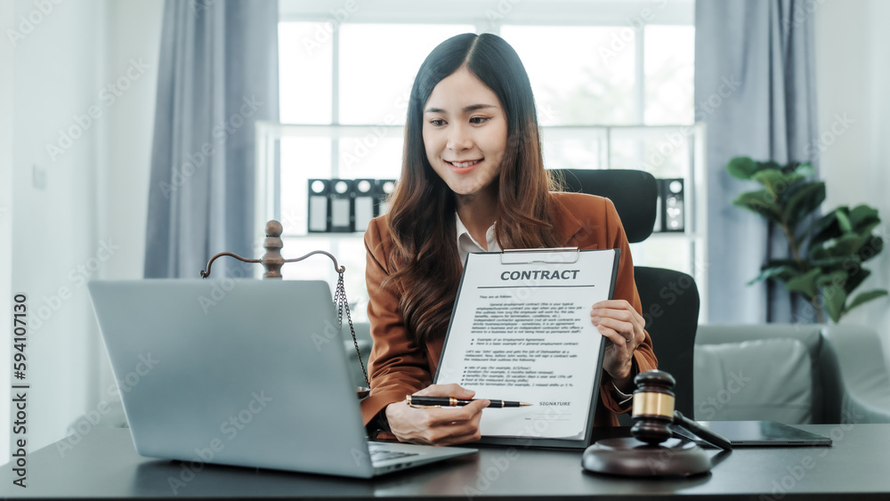 Explain the details of the contract. Online consulting with laptop in office of asian thai japanese chinese female exclusive lawyer legal advisor, legislation, saleswoman, legal contract documents