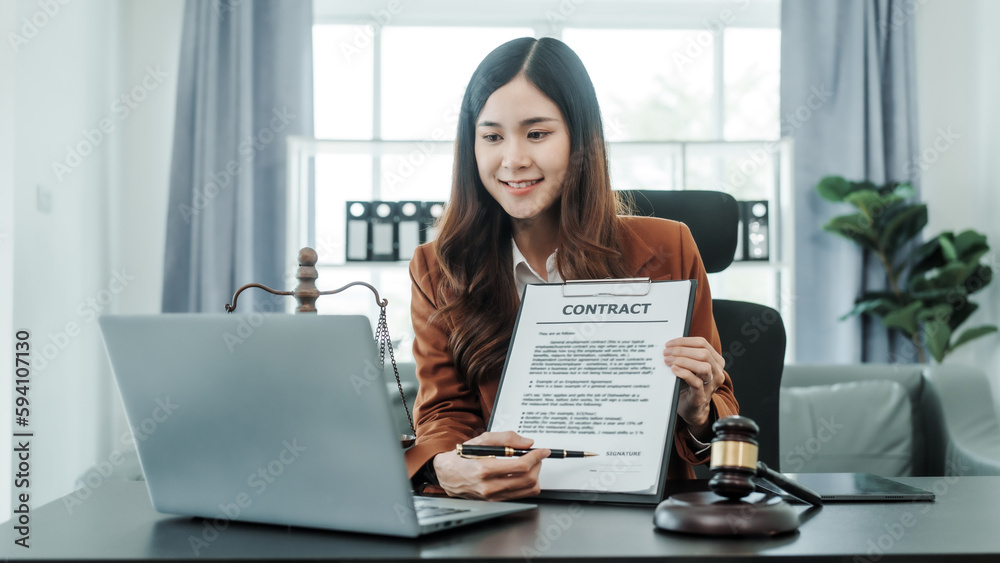 Explain the details of the contract. Online consulting with laptop in office of asian thai japanese chinese female exclusive lawyer legal advisor, legislation, saleswoman, legal contract documents Explain the details of the contract. Online consulting with laptop in office of asian thai japanese chinese female exclusive lawyer legal advisor, legislation, saleswoman, legal contract documents