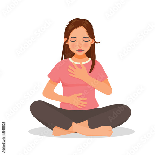 Young woman doing deep breathing exercise during yoga practice