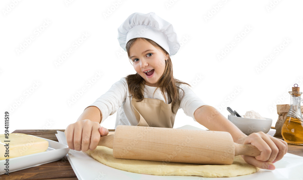 Happy child in chef costume stretch the dough Happy child in chef costume stretch the dough