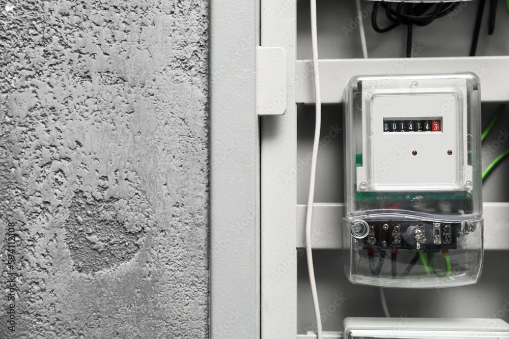Electric meter and wires in fuse box, space for text Electric meter and wires in fuse box, space for text