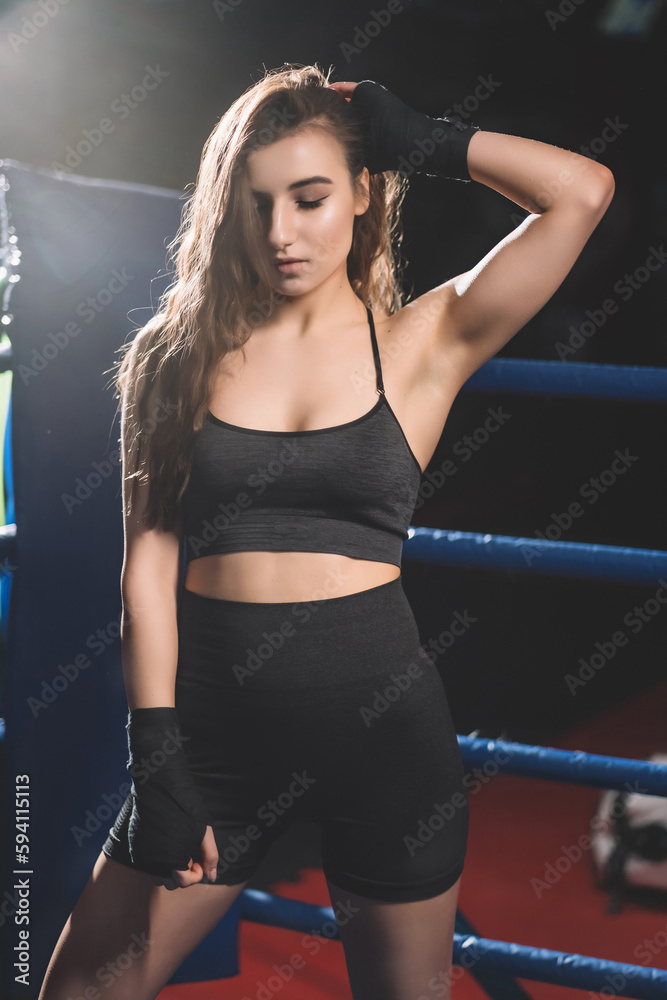 female muay thai boxer resting after sparring female muay thai boxer resting after sparring