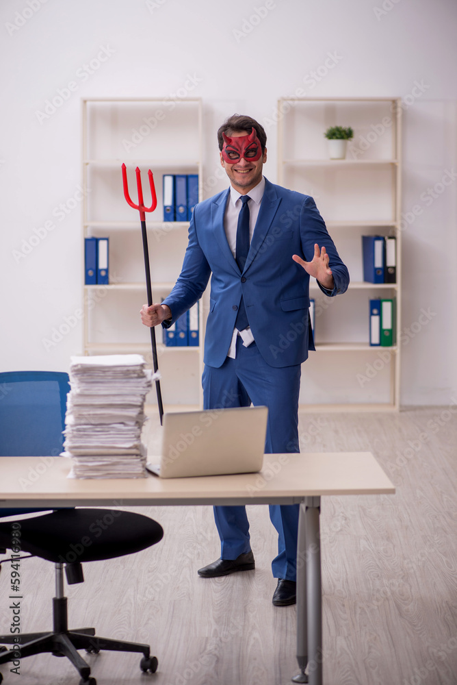 Devil businessman and too much work in the office Devil businessman and too much work in the office