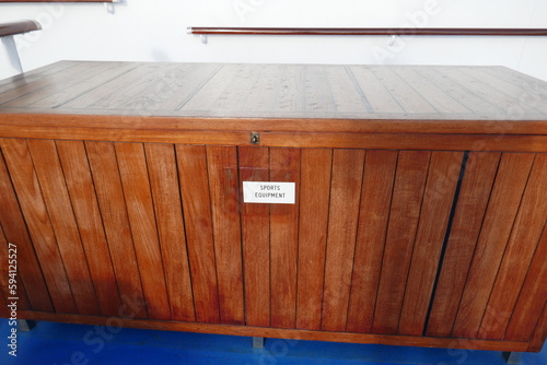 Cruise ship wooden chest to hold sports recreational equipment © Adventuring Dave