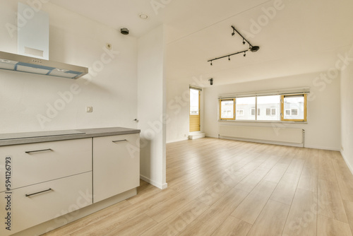 an empty kitchen with white cabinets and light wood floors in the room is very clean, but it's no longer