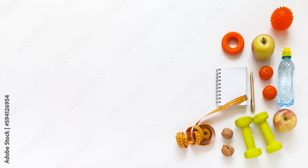 Healthy lifestyle concept. Diet plan. Activity and weight loss. Slimming for summer. Notepad, measuring tape, dumbbells, expander, massager, fruits, nuts and water on white background. Banner - obrazy, fototapety, plakaty 