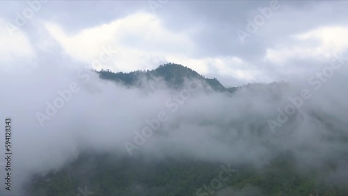 Aerial shot of a mountain entirely in the clouds, in Darjeeling, India