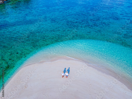 couple of men and women on the beach of Ko Lipe Island Thailand