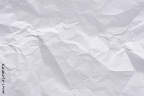 White crumpled paper texture background, clean white wrinkled paper, top view.