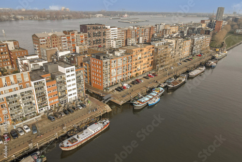 Wallpaper Mural some boats in the water and buildings on the other side of the river that are all connected to each other area Torontodigital.ca