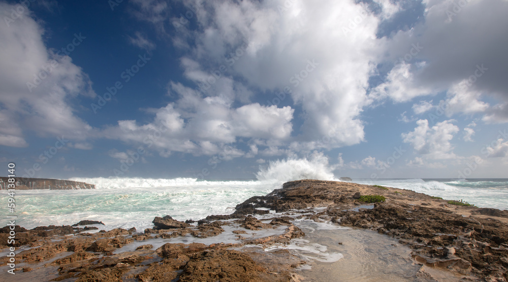 Dramatic landscape and sky with storm waves at Laie Point at Kaawa on the North Shore of Oahu Hawaii United States Dramatic landscape and sky with storm waves at Laie Point at Kaawa on the North Shore of Oahu Hawaii United States