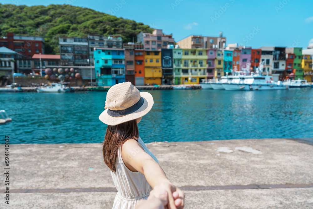 Couple traveler visiting in Taiwan, Tourist sightseeing in Keelung, Colorful Zhengbin Fishing Port, landmark and popular attractions near Taipei city. trip, love, together and summer vacation concept