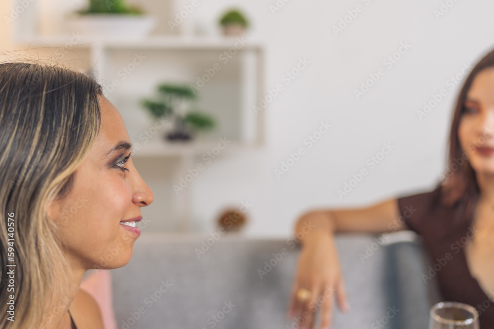 Woman talking with a friend in a home party