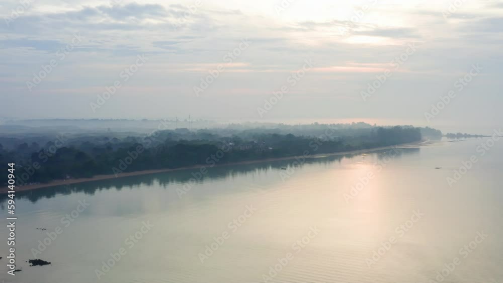 Misty haze above ocean coastline with tropical rainforest in Thailand. Misty haze above ocean coastline with tropical rainforest in Thailand.